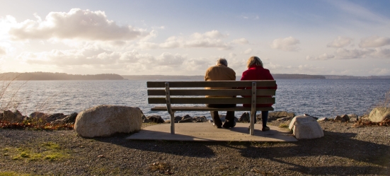 16435601 – an old man and woman enjoying the view at sunset