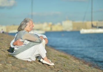 40199489 – amusing elderly couple having rest near river